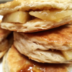 Freshly baked Apple Pie Biscuits with a golden, flaky crust and a hint of cinnamon and apples.