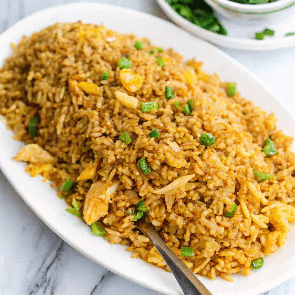 A plate of delicious homemade egg fried rice with vibrant veggies.